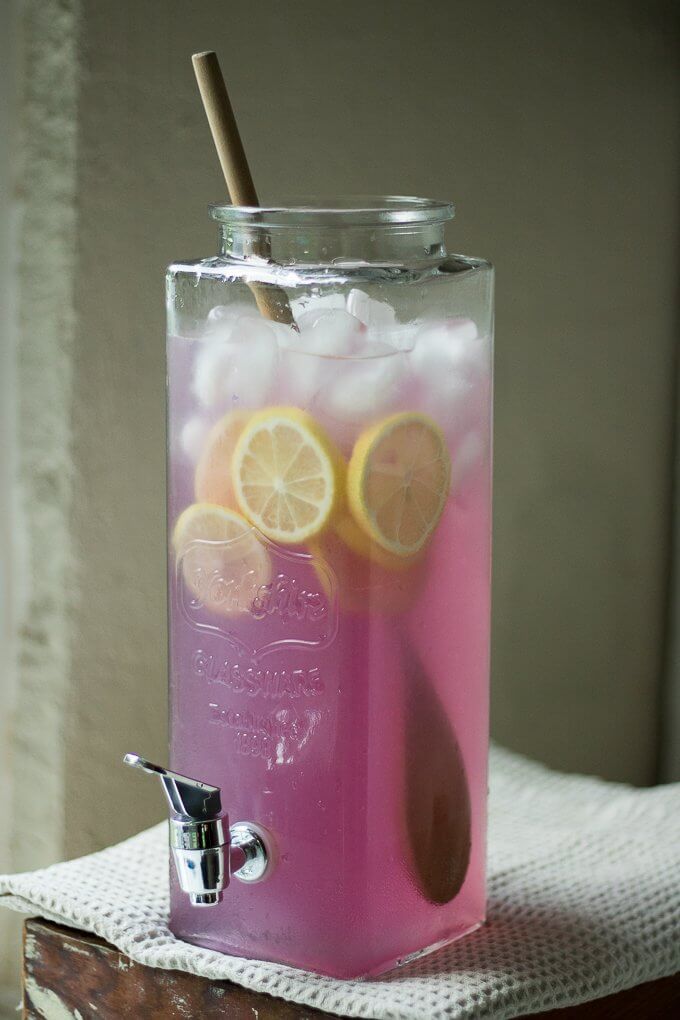 Blue Butterfly Pea Flower Lemonade is a sweet, tart and refreshing drink to level up your regular lemonade recipe. When making this recipe, as you add the lemon juice, it turns from an all natural dark blue to purple-pink thanks to the Blue Butterfly Pea Flowers. #peaflowers #lemonade #bluebutterflypeaflowers #drinks #iced #colddrinks 
