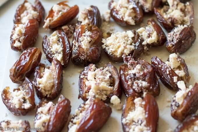 Bacon Wrapped Stuffed Dates are a savory-sweet appetizer or snack, served hot, perfect for having at a gathering. Pitted Medjool dates stuffed with soft cheese like Blue or Stilton Cheese, then wrapped with thick-sliced bacon and baked on a cast iron grill pan (or rimmed baking sheet). They are so delicious and mouthwatering that you can never have just one! #bacon #recipe #dates #Stilton #stuffeddates #hotappetizers #appetizers #gameday #Christmasfood #christmas