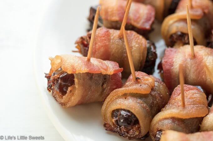 Bacon Wrapped Stuffed Dates are a savory-sweet appetizer or snack, served hot, perfect for having at a gathering. Pitted Medjool dates stuffed with soft cheese like Blue or Stilton Cheese, then wrapped with thick-sliced bacon and baked on a cast iron grill pan (or rimmed baking sheet). They are so delicious and mouthwatering that you can never have just one! #bacon #recipe #dates #Stilton #stuffeddates #hotappetizers #appetizers #gameday #Christmasfood #christmas