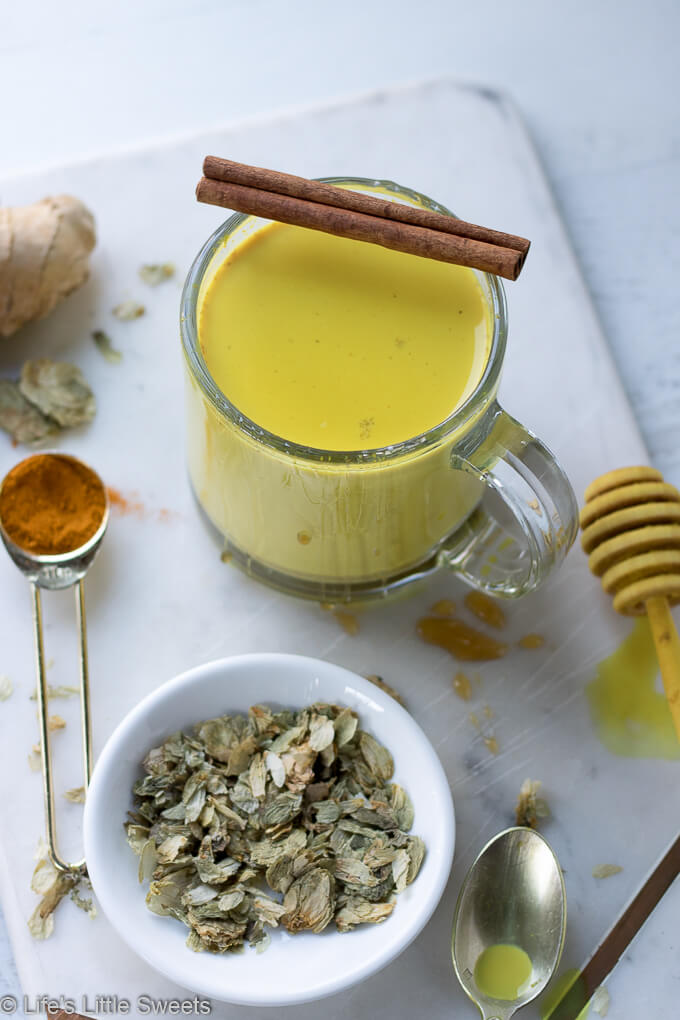 This Hops Golden Milk recipe is a hot, comforting, spiced drink that can have relaxing effects due to the infusion of hops flowers. Hops flowers are known for calming nerves and promotes relaxation. Enjoy this delicious, vibrant, hot drink (dairy-free/vegan option, 2 servings) #hops #driedhops #goldenmilk #recipe #drinks