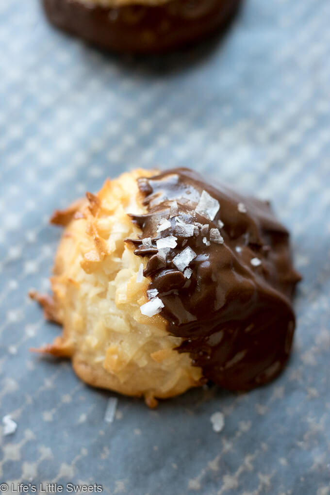 This is classic Coconut Macaroons cookie recipe has the option to be dipped in dark chocolate and sprinkled with sea salt crystals.  #coconutmacaroons #coconut #darkchocolate #cookies #seasalt #sweetenedcondensedmilk #sweetenedcoconutflakes 