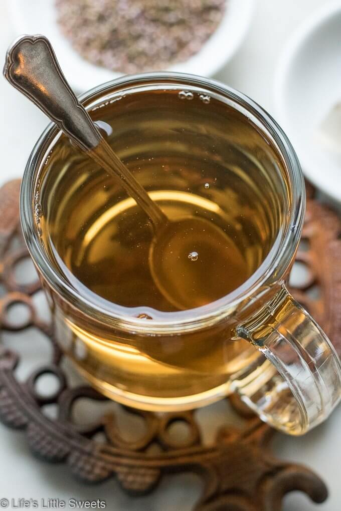 This Heather Flower Tea is a hot, strong herbal drink that helps sooth a cough, cold, congestion. Here is a tutorial on How to make Heather Tea to help get you through Wintertime or any time you are in need of restoration. #heatherflowers #heather #tea #remedy #tutorial #flowertea #coldremedy #glutenfree #hotdrink #drink #vegan #vegetarian
