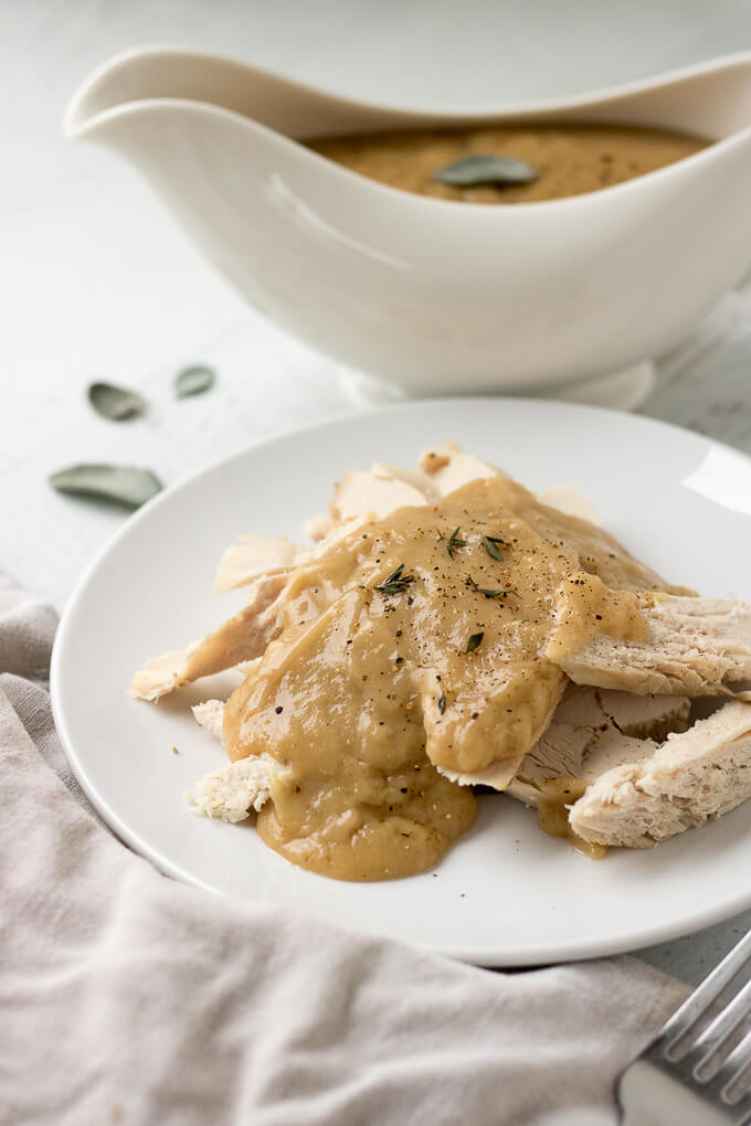 This Homemade Turkey Gravy Recipe tutorial helps you make the most delicious turkey gravy from scratch! It’s savory, the perfect consistency (thickened with all-purpose flour), herb-infused with sage, rosemary and thyme (optional) and has a splash of sherry or white wine (optional). #gravy #turkeygravy #turkey #homemade #recipe #Thanksgiving #Christmas #dinner