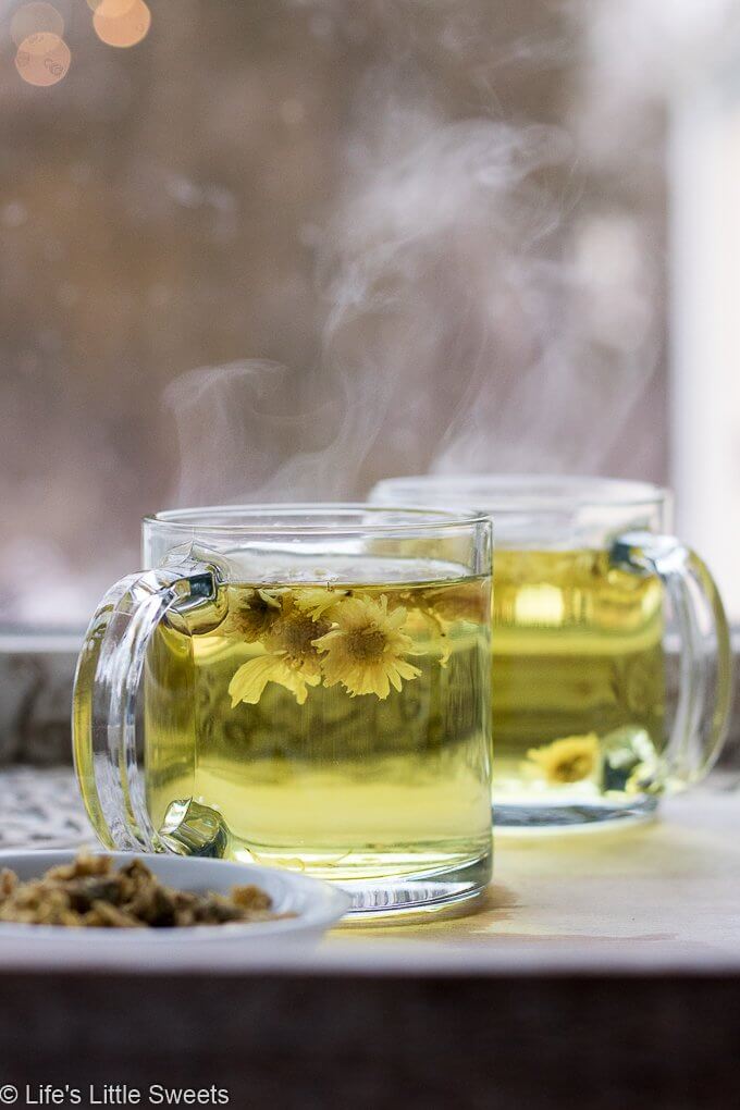 Hot tea in a clear mug, by a window, How to Make Chrysanthemum Flower Tea
