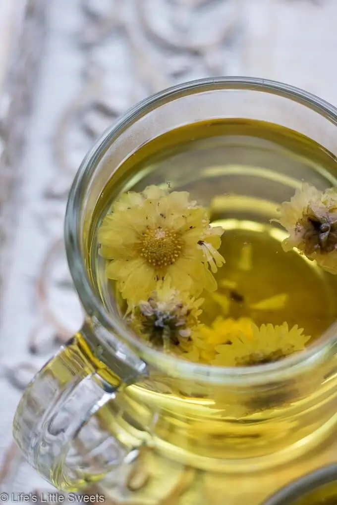 a mug of hot Chrysanthemum Flower Tea on a tray