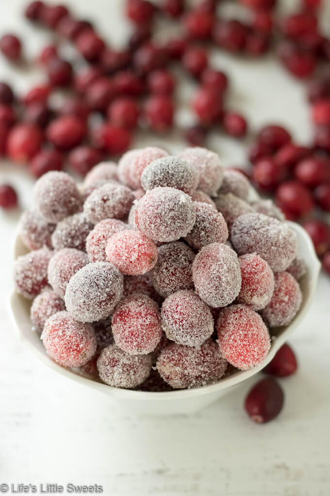 Sugared Cranberries are sweet, tart and are wonderful as garnishes on cocktails, on appetizer boards or to top desserts. They add a bright, red and festive flair to any table - plus they are easy to make with only 2 required ingredients on the stove top! #sugaredcranberries #cranberries #sugar #sweet #tart #garnish #Winterfood #appetizer #brownsugar Sugared Cranberries are sweet, tart and are wonderful as garnishes on cocktails, on appetizer boards or to top desserts. They add a bright, red and festive flair to any table - plus they are easy to make with only 2 required ingredients on the stove top! #sugaredcranberries #cranberries #sugar #sweet #tart #garnish #Winterfood #appetizer #brownsugar