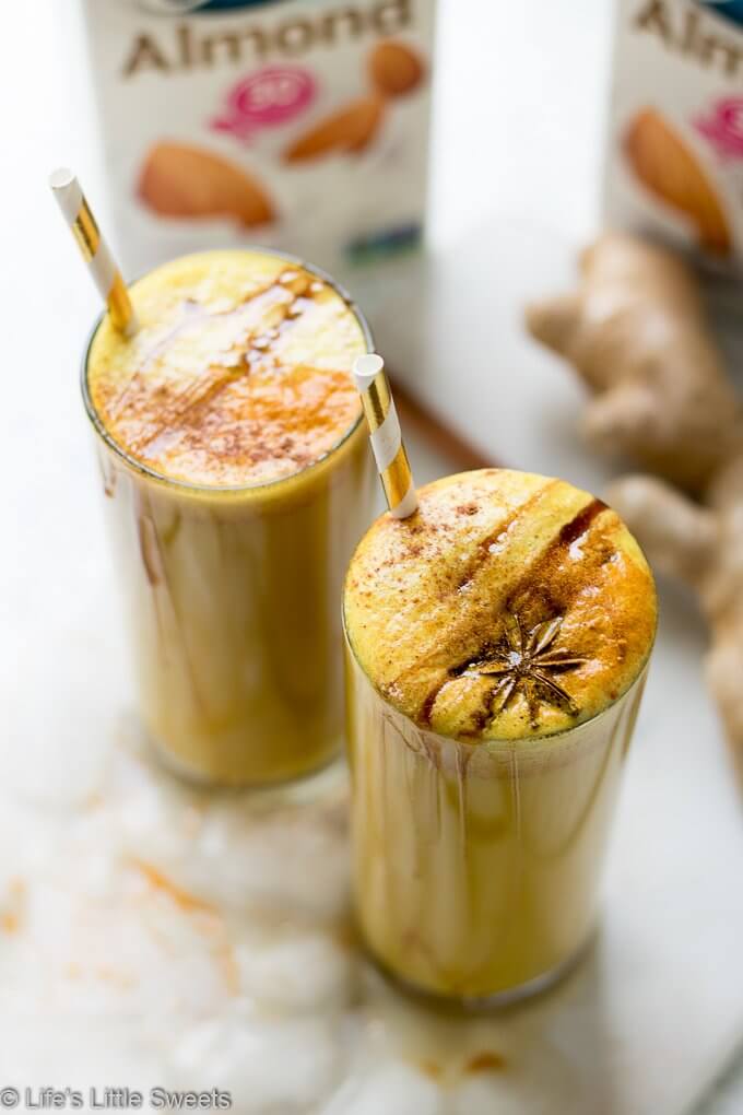 This Vegan Golden Milk Smoothie recipe is a spiced, non-dairy treat with turmeric, fresh ground black pepper, ground cinnamon and Silk Unsweetened Almondmilk! Naturally sweetened with maple syrup and optional dates. #ad #tastyprogress #CollectiveBias #vegan #goldenmilk #smoothie #Osterblender @lovemysilk