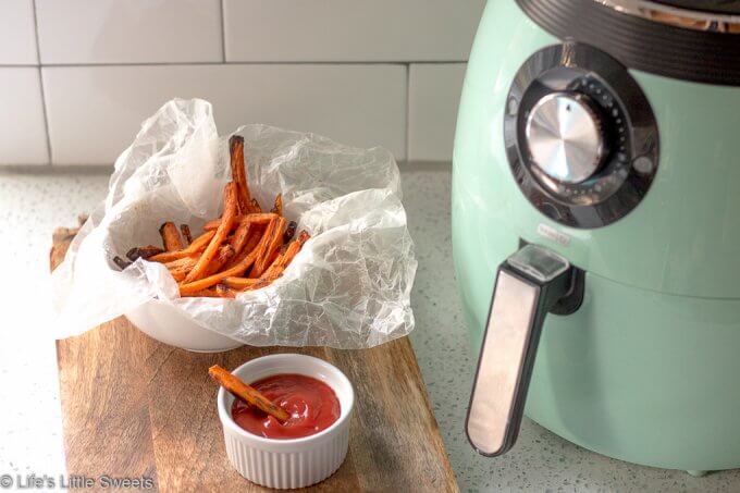 Air Fryer Carrot Fries have ground cumin, smoked paprika, kosher salt and fresh ground pepper with a small amount of Canola oil. This is a more healthy version of carrot fries with less oil using an Air Fryer. This easy recipe only requires 7 ingredients and 15 minutes! (gluten free, vegan) #ad #carrots #carrot #fries #airfried #airfryer #easy #airfryercarrotfries #savory #recipe #cumin #paprika #salt #pepper