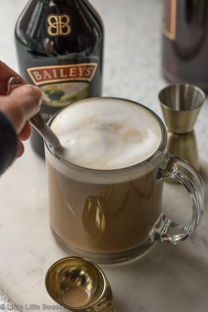 (MSG 21+) Irish Coffee is a alcohol-infused coffee drink, with Baileys Irish Cream and Irish Whiskey. This is a warming coffee drink perfect a cold day and/or to serve for brunch. #irishcoffee #Irishwhiskey #whiskey #BaileysIrishCream #cream #Stpatricksday #drinks #coffee