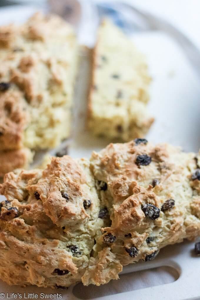 This Irish Soda Bread recipe has raisins (or currants) and optional caraway seeds; this round quick bread easy to make in your cast iron skillet, baked in the oven. Enjoy it for St. Patrick's Day or any time of the year. #sodabread #Irishsodabread #raisins #American #recipe #bread #quickbread #carawayseeds #StPatricksDay