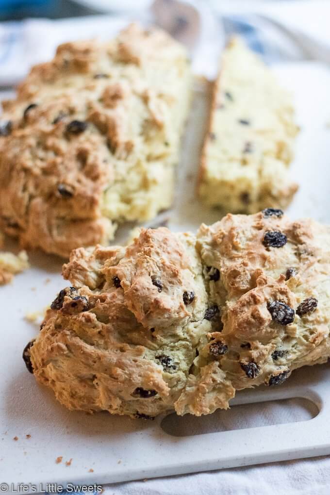 This Irish Soda Bread recipe has raisins (or currants) and optional caraway seeds; this round quick bread easy to make in your cast iron skillet, baked in the oven. Enjoy it for St. Patrick's Day or any time of the year. #sodabread #Irishsodabread #raisins #American #recipe #bread #quickbread #carawayseeds #StPatricksDay