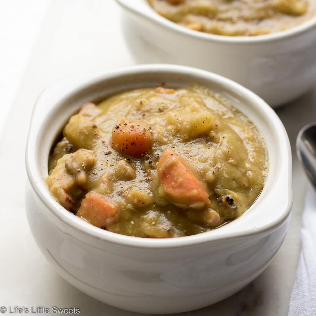 Split Pea Soup is hearty soup filled with protein, veggies and carbs, perfect for sustaining you during cold weather. Enjoy this classic, family soup recipe which is a meal in an of itself! #splitpeasoup #recipe #carrots #peas #potatoes #ham #savory #bayleaves #marjoram #celery