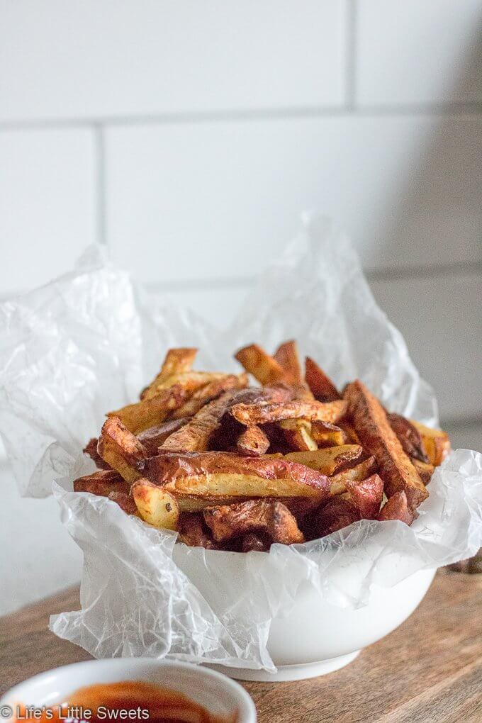fries on a white kitchen counter with white subway tile in the background