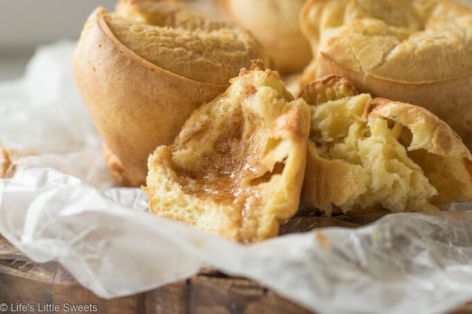 Popovers are an American bread recipe made of an egg and flour-based batter baked in individual molds. Also, known as the “American Yorkshire Pudding,” this recipe dates back to 1850. They can be served any time of the day and are delicious when eaten fresh and topped with Maple Cinnamon Butter. Popovers recipe! #popovers #recipe #homemade #appetizer #bread #eggs