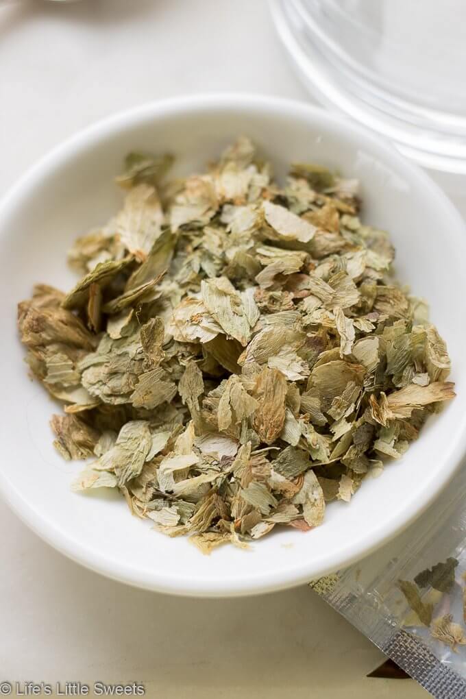 Hops Flower Tea Dried Hops flowers in a small white shallow dish