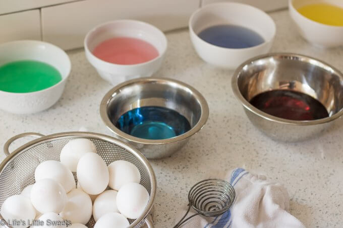 How to Make Dyed Easter Eggs with colored water on a counter
