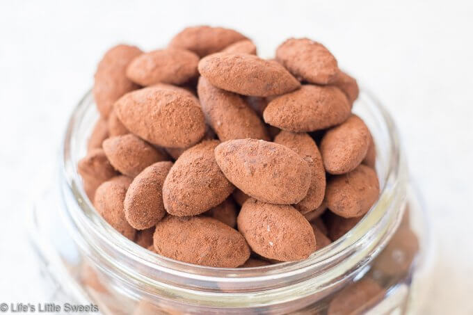 Cocoa Almonds overflowing in a clear mason jar