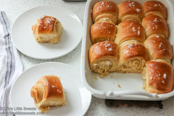 Parker House Rolls being served on white dishes