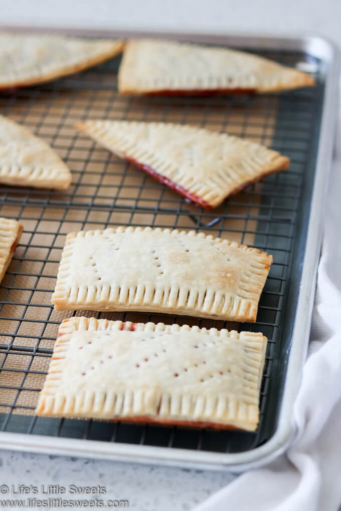 These Pop Tarts are so easy to make with store bought pie crust dough and your favorite jam. It only takes 2 ingredients and some time in the oven and you will have your own, sweet and delicious homemade pop tarts! #poptarts #homemade #recipe #snack #breakfast #dessert www.lifeslittlesweets.com