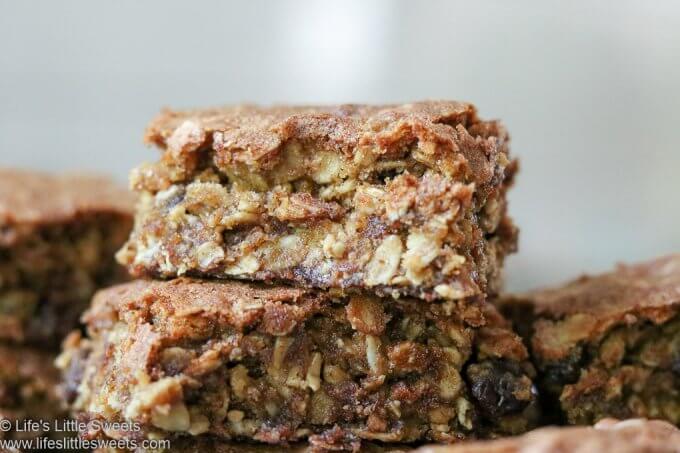 Oatmeal Raisin Cookie Bars stacked on a plate in a white kitchen