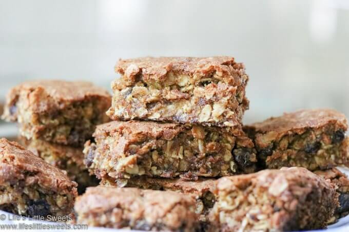 Oatmeal Raisin Cookie Bars stacked on a plate in a white kitchen