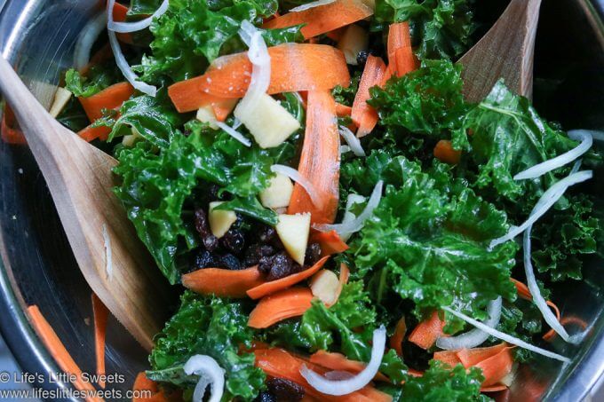 Apple Carrot Raisin Massaged Kale Salad in a bowl