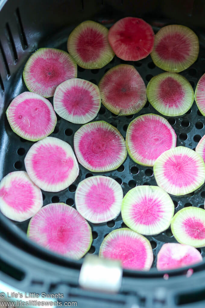 Watermelon Radish slices in an air fryer basket