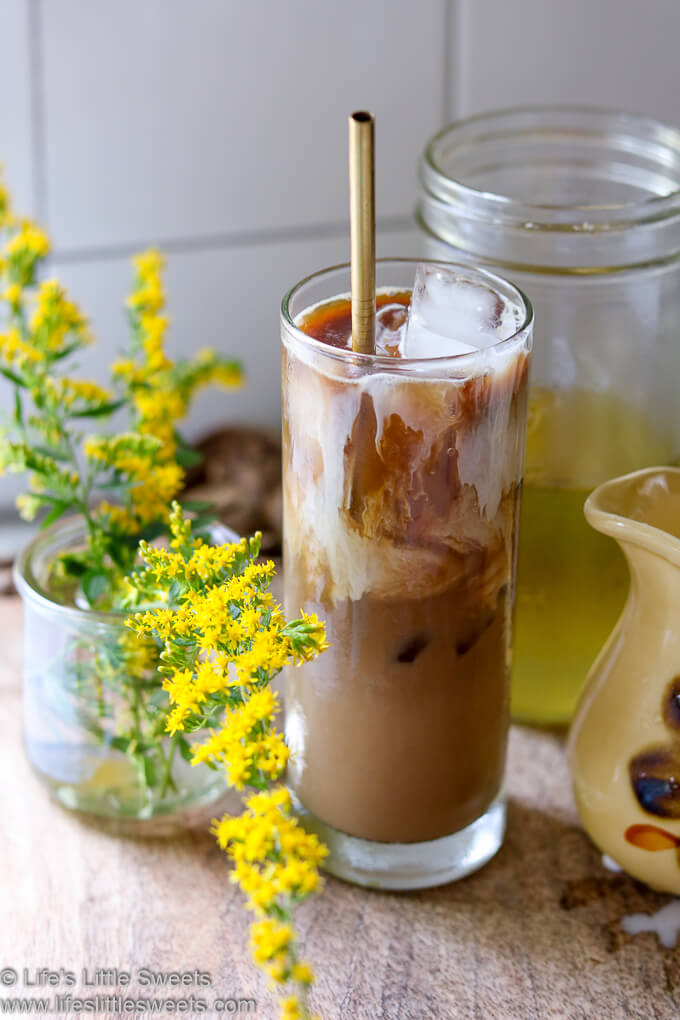 Goldenrod Iced Coffee with fresh flowers in a white kitchen