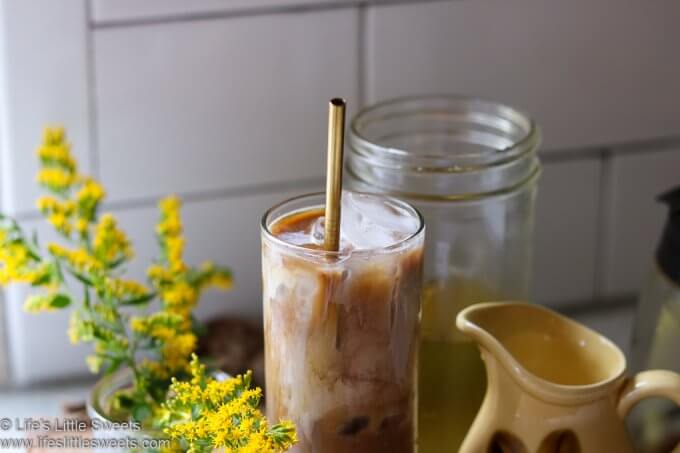 Goldenrod Iced Coffee with yellow flowers in a white kitchen