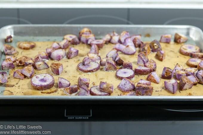 Roasted Radishes on a sheet pan on a stove top