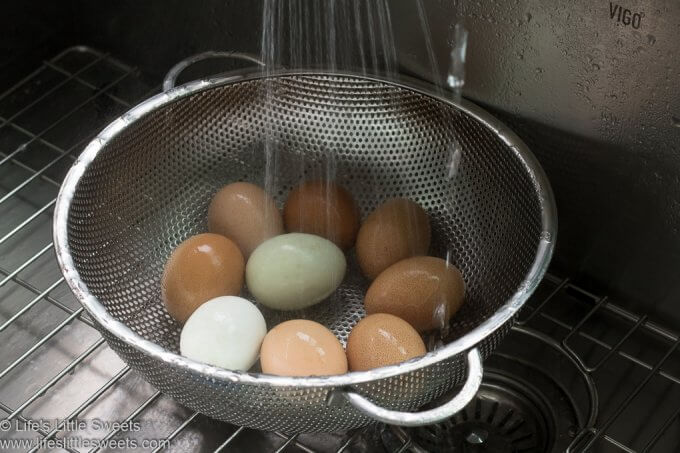 washing farm fresh eggs in a sink