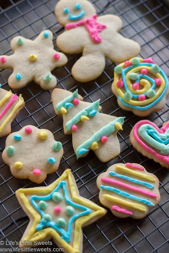 Cutout Sugar Cookies on a cooling rack with colorful Royal Icing