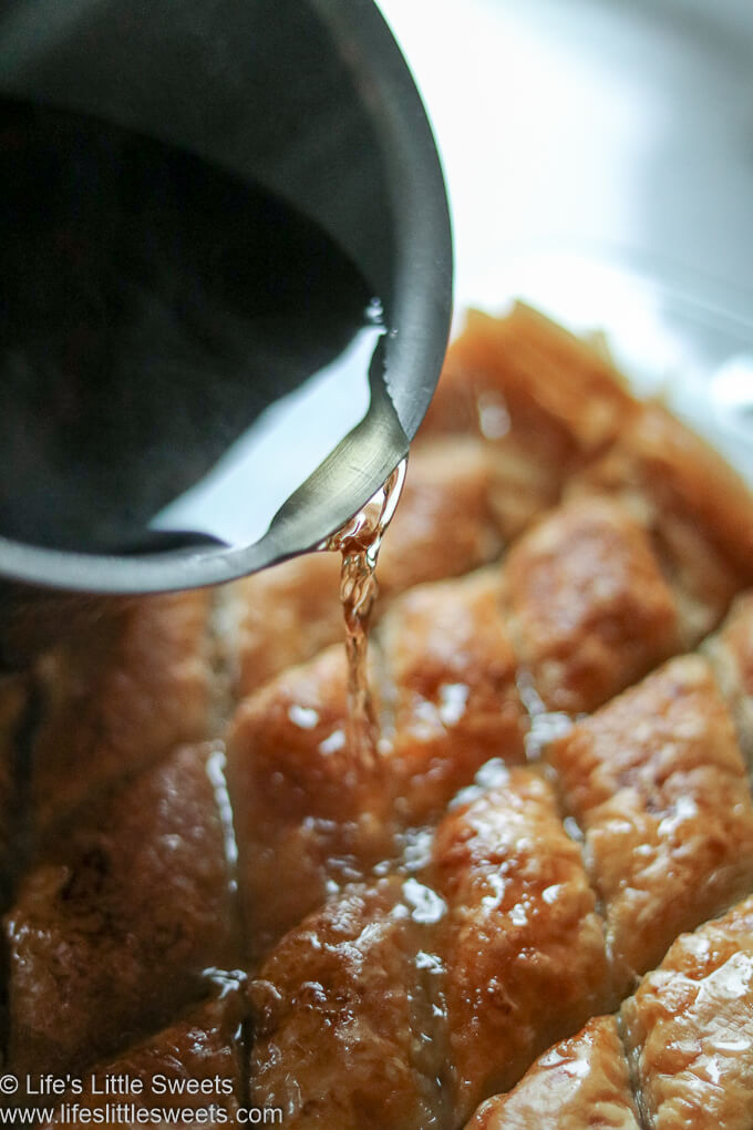 pouring sugar syrup over Maple Syrup Baklava