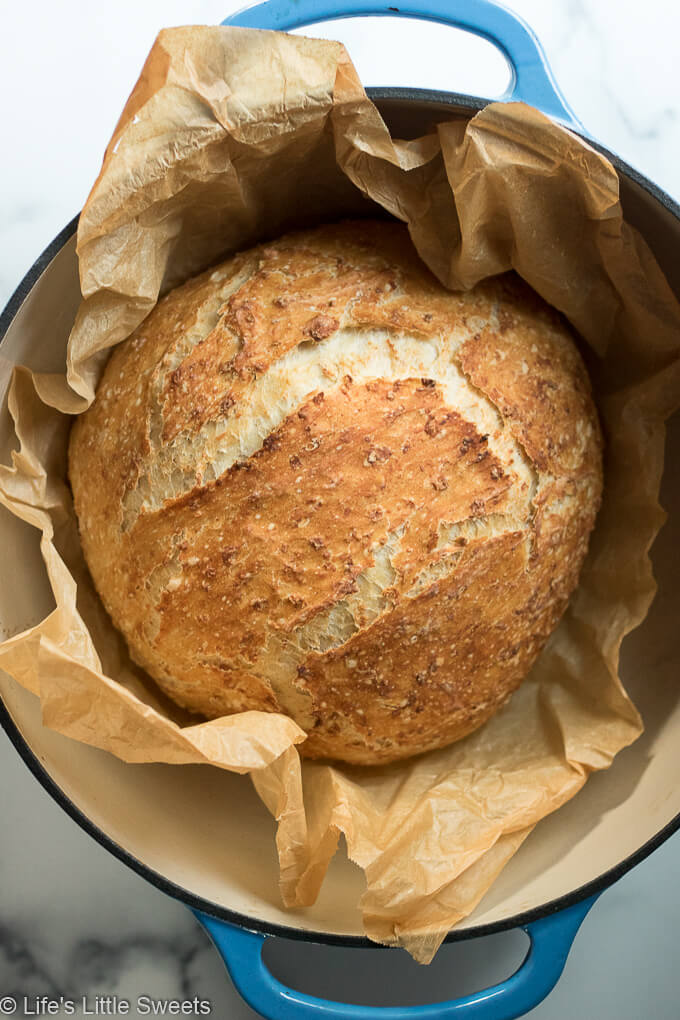 No-Knead Oatmeal Bread in a Dutch oven with parchment paper