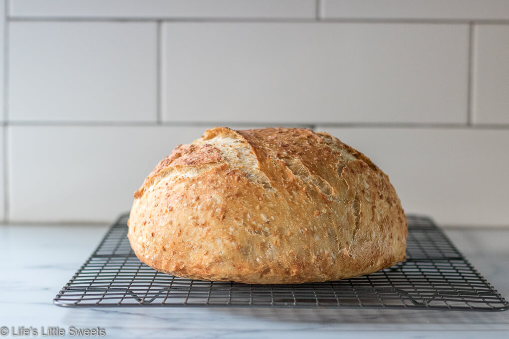 No-Knead Oatmeal Bread crusty bread on a wire cooling rack