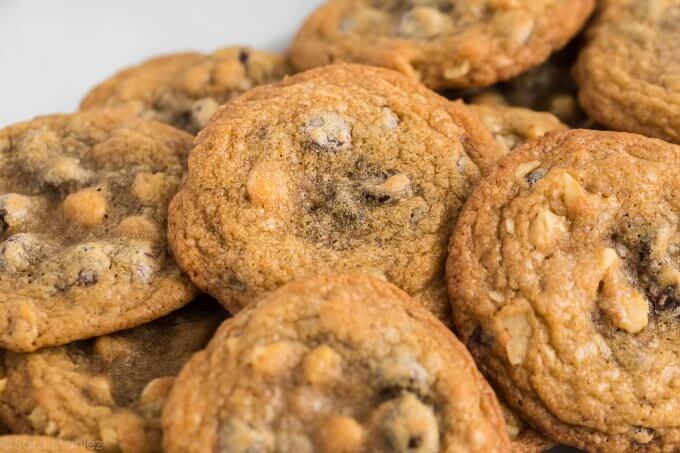 a pile of Chocolate Chip Cookies on a white plate