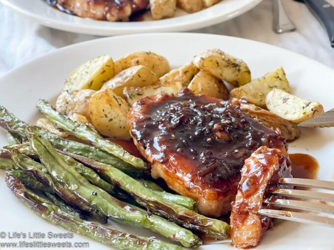 a dinner with roasted potatoes, pork chops and green beans