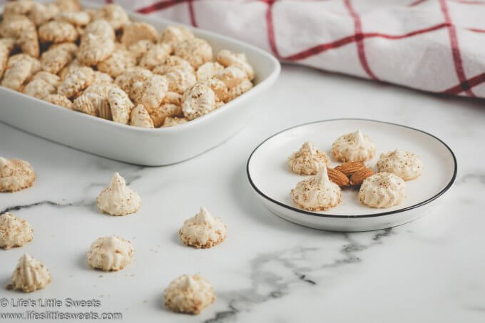 a photo of Almond Meringue Kisses cookies on a white marble countertop