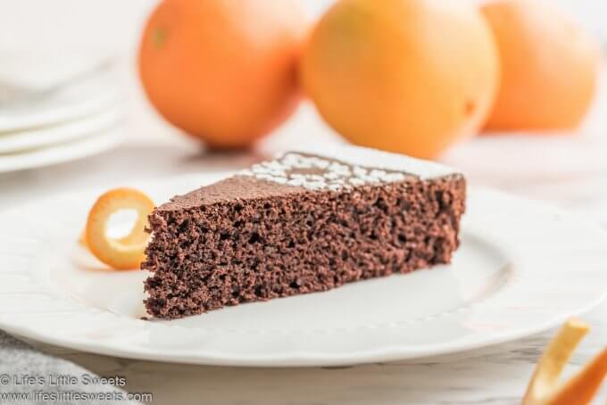 Chocolate Orange Almond Cake slice on a white plate