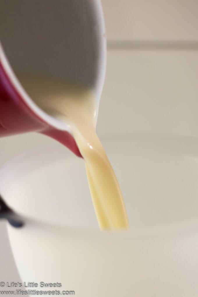 Homemade Coffee Creamer being poured in a funnel