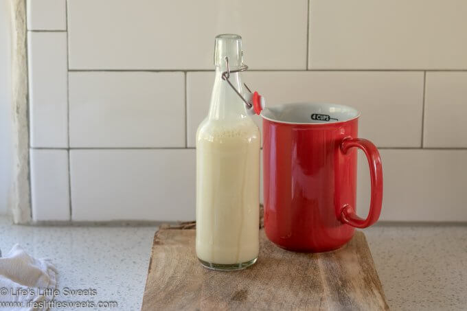 Homemade Coffee Creamer in a swing-top bottle in a white kitchen