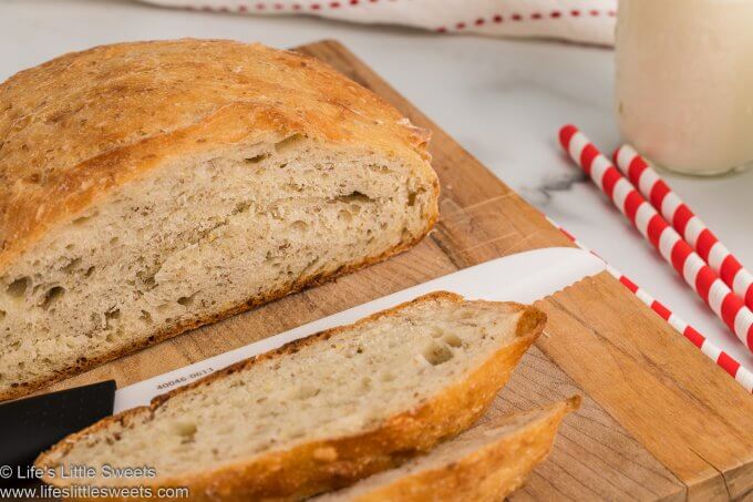 No-Knead Flaxseed Bread sliced on a wood cutting board