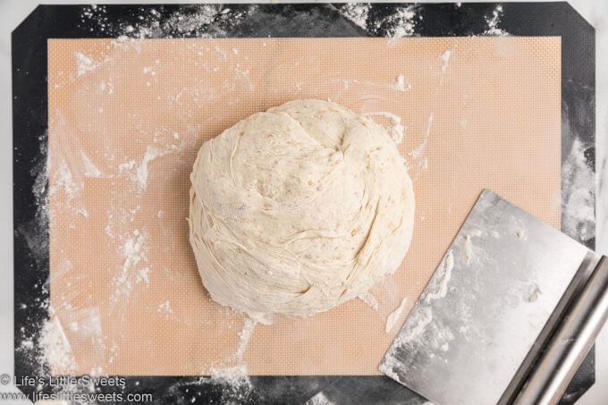 turn the bread dough on a floured surface and turn over 12 times with a dough scraper