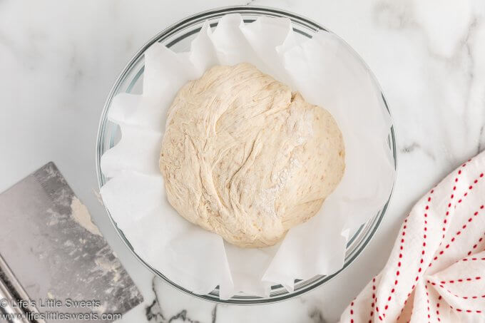 Put the dough ball into a parchment-lined mixing bowl