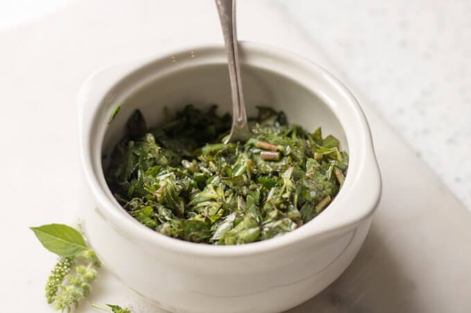 Purslane Herb Salad in a white crock bowl