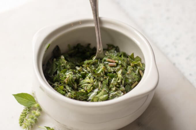 Purslane Herb Salad in a white bowl