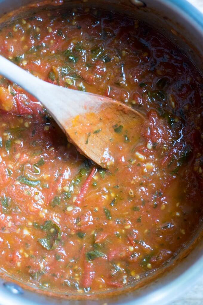 Tomato sauce on a wooden spoon