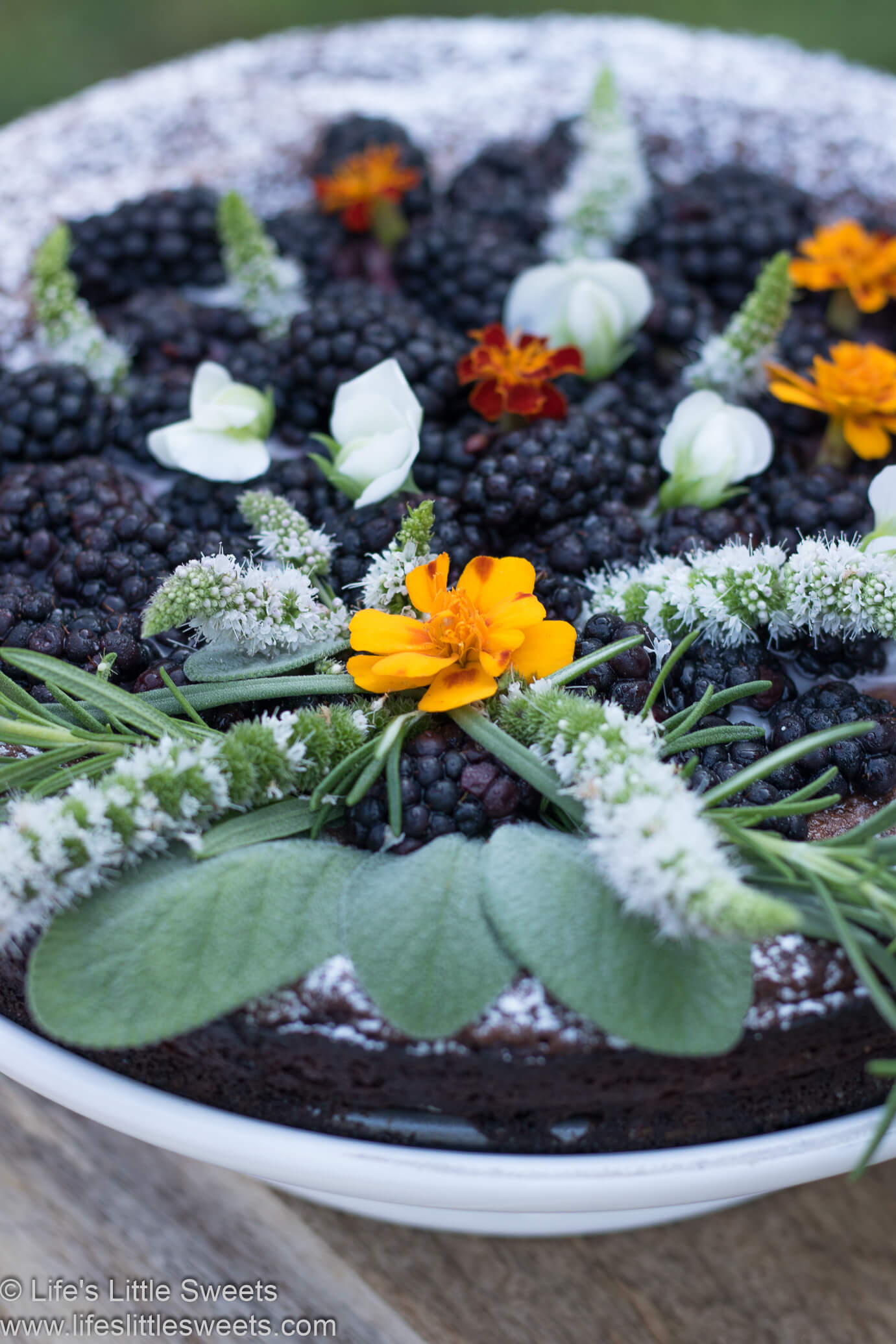 Flourless Chocolate Cake with Blackberries and Edible Flowers
