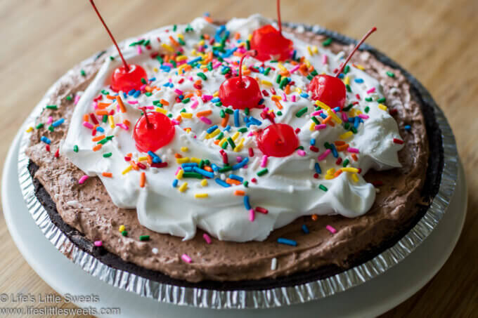 Chocolate Pudding Pie decorated with Cool Whip, color sprinkles and cherries