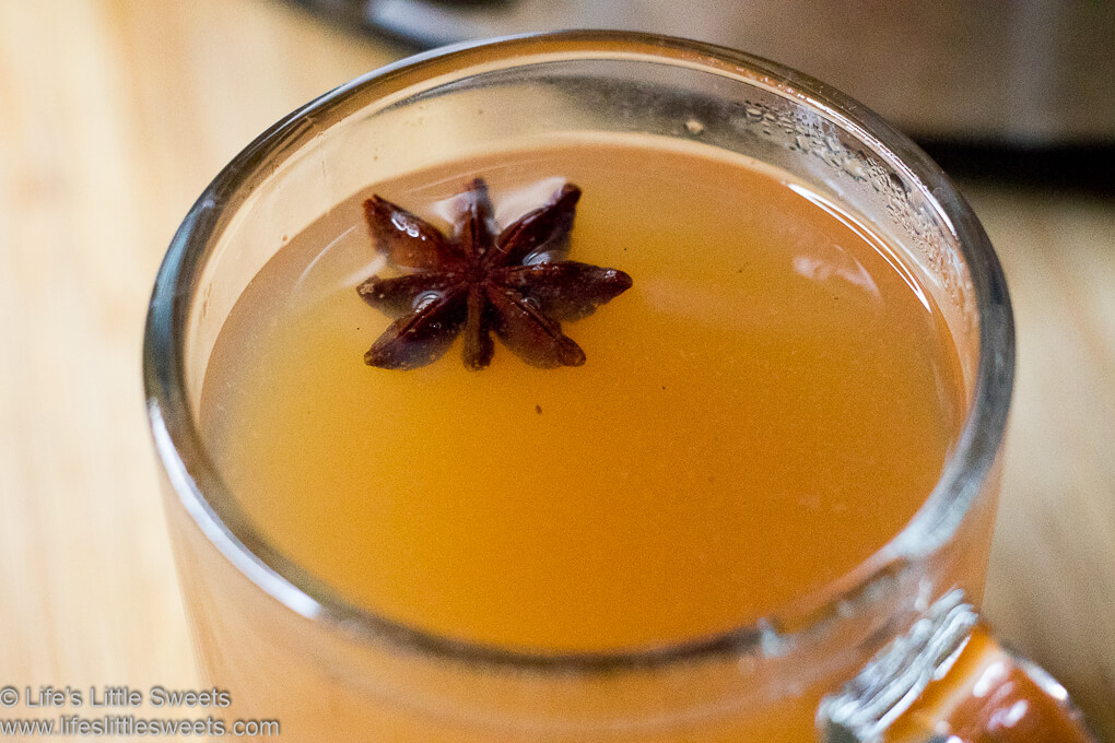 Hot Mulled Cider (Wassail) in a clear mug with star anise